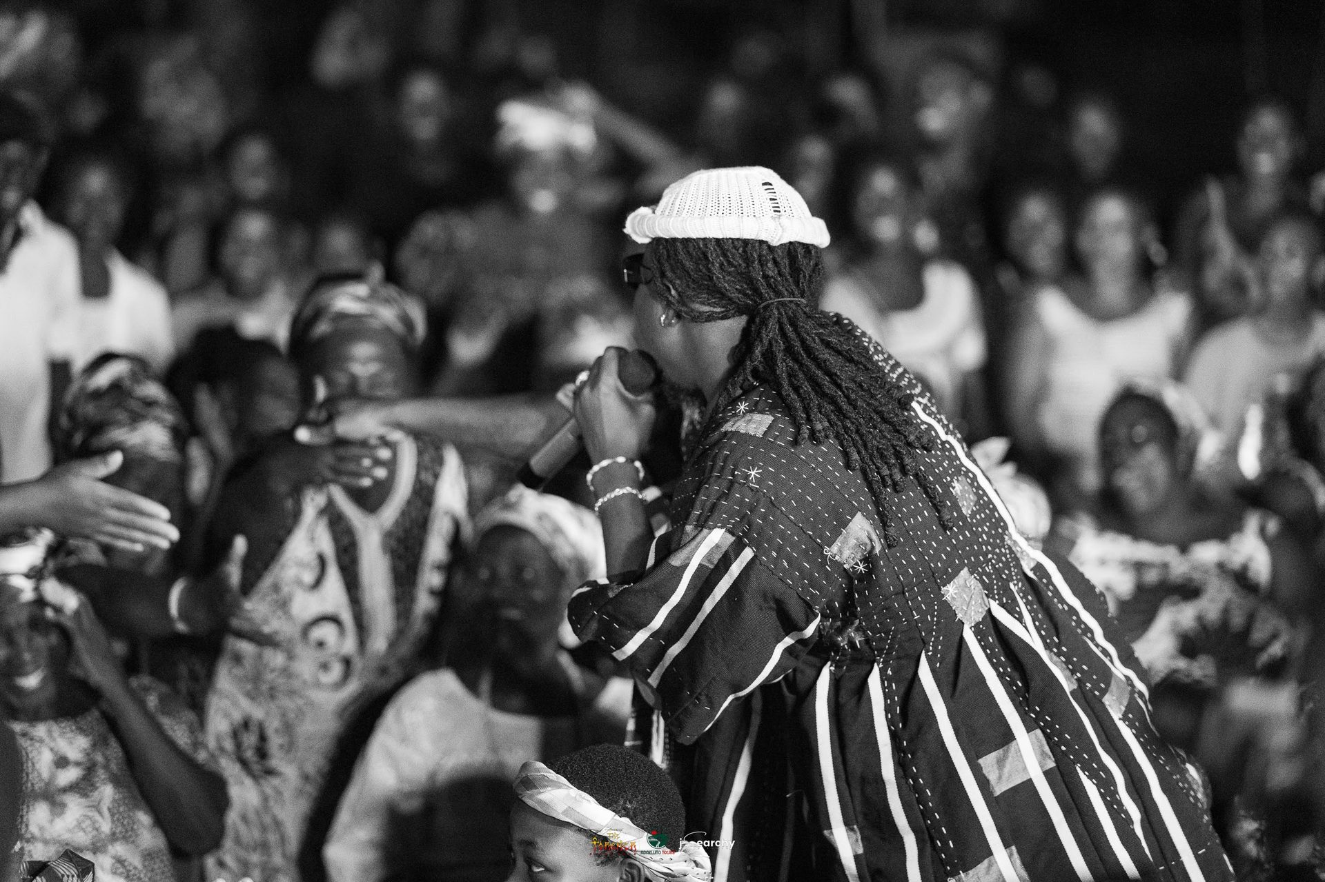 Portrait of Stonebwoy with an elder during the ceremony